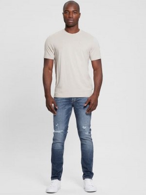 Guess Finnley Distressed Tapered Jeans Blauw | GUESS-SN30421